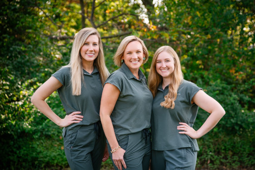 The Hearing Consultants team posing outdoors in matching outfits