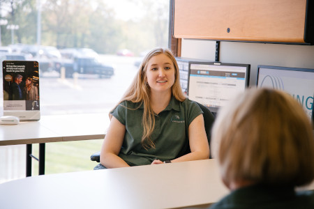 Dr. Taylor Turner sitting behind a table while consulting